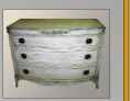 Antique white trimmed with green in a milk paint finish