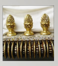Gilded finials with burnt sienna; mahagony pole and rings trimmed with gold leaf